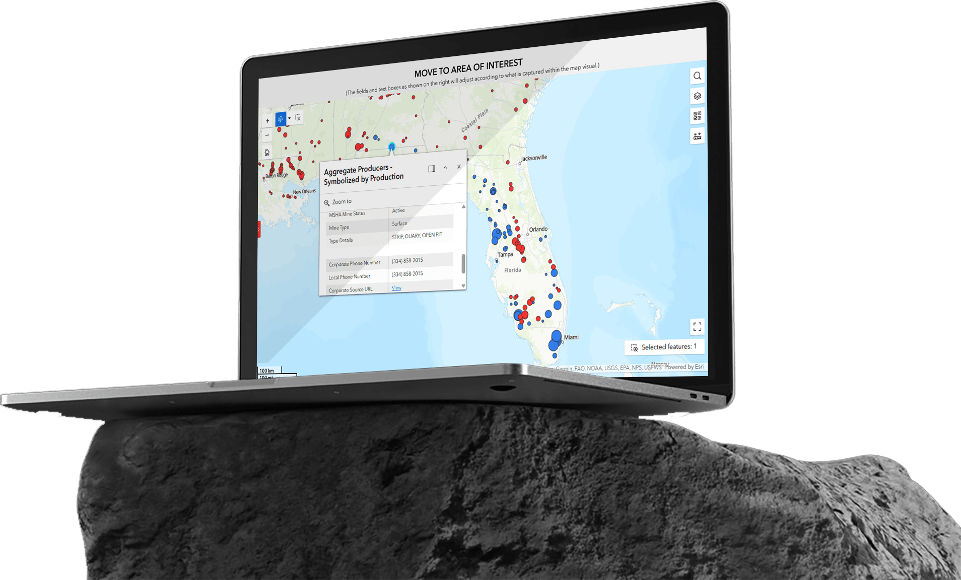 Mineralocity platform shown on a laptop resting on a rock