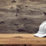 A hardhat sits on a wooden table. Defending Market Share in the Aggregate Industry